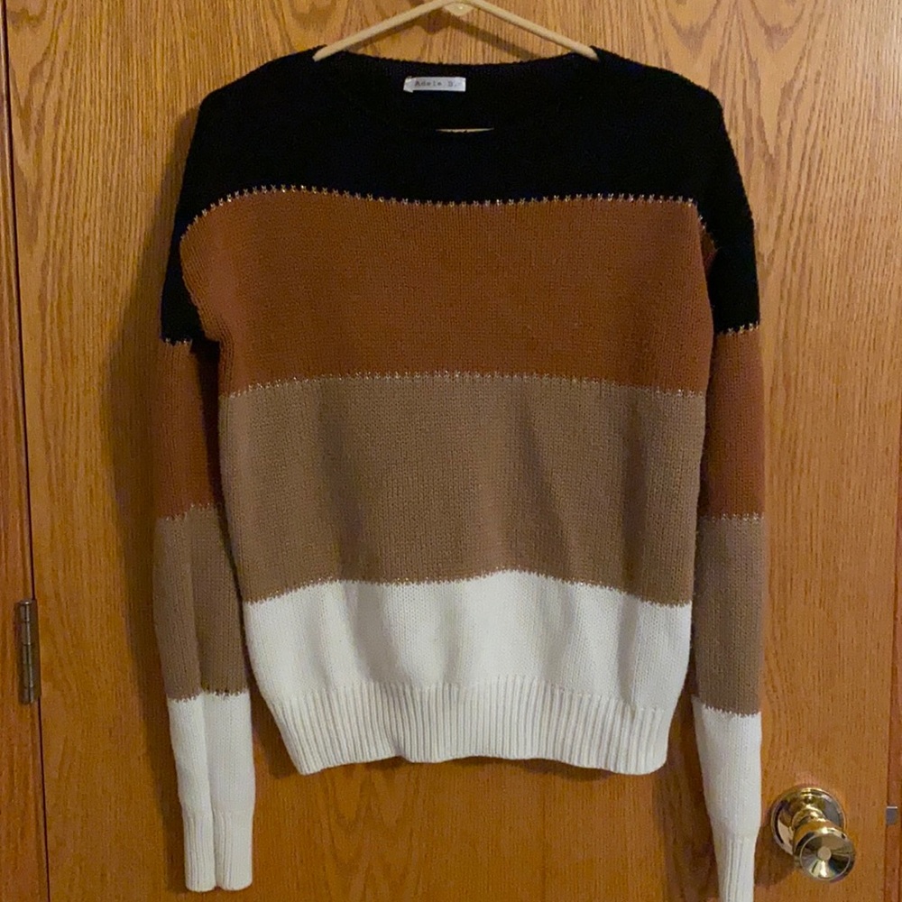 Black, brown, and white sweater with gold stitching design